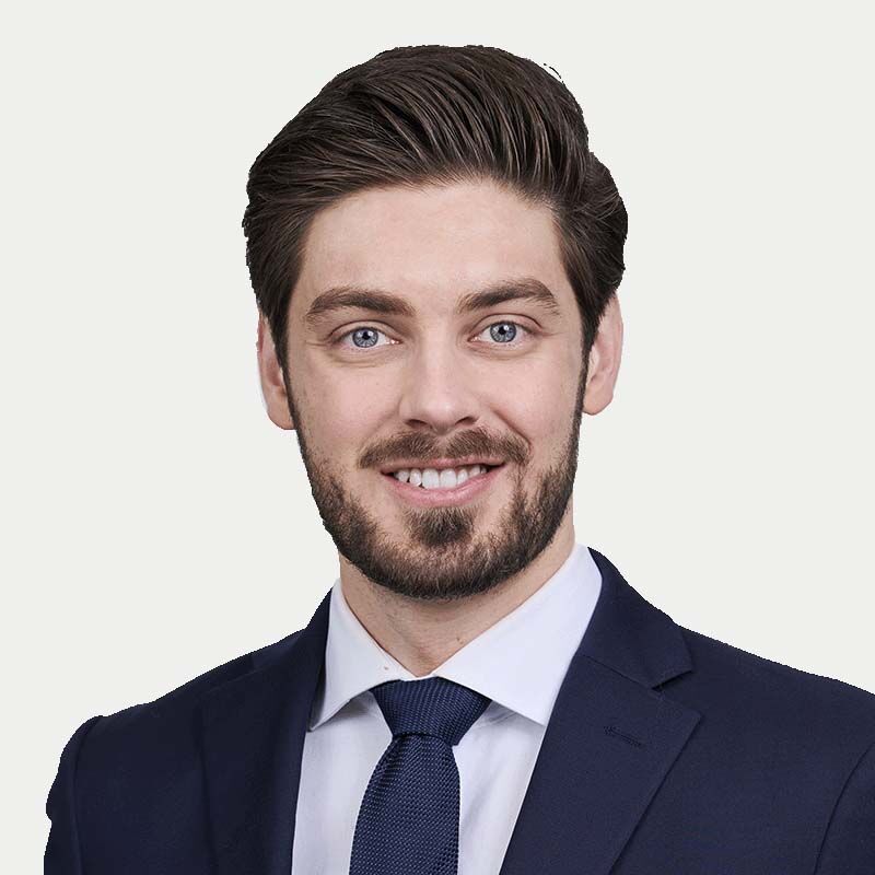 Drew McArthur, Associate at Gowling WLG seen in white color shirt and dark blue color suit